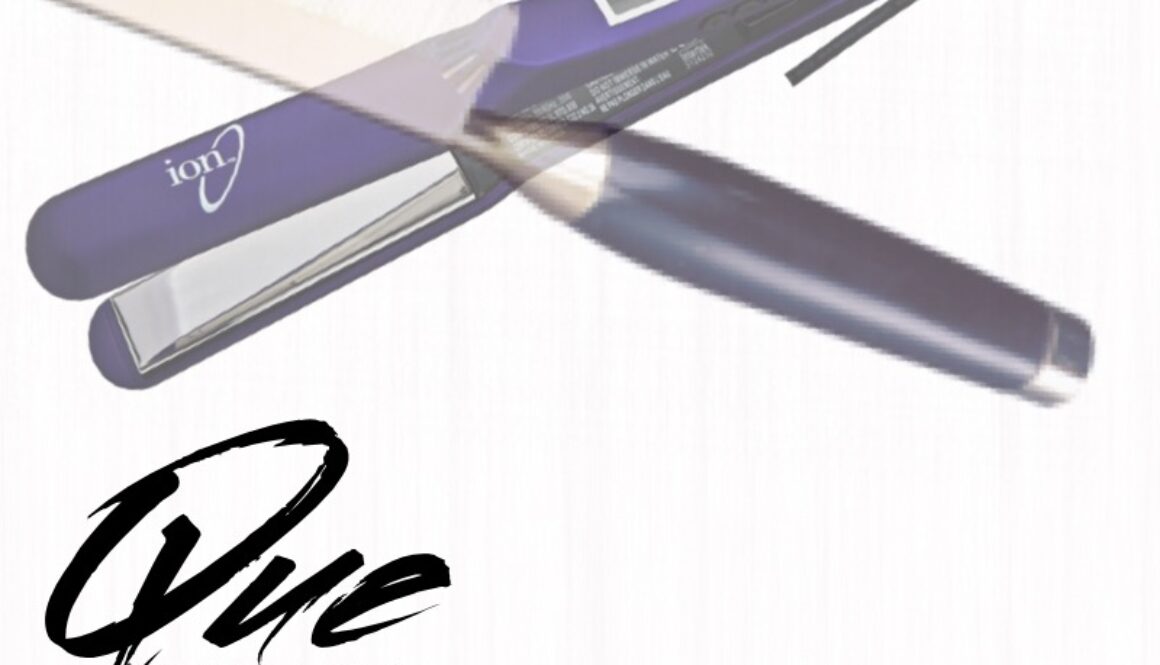 Purple hair straightener with a gold plate and logo.