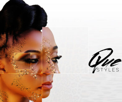 Profile of a woman with styled hair and makeup against a white background.